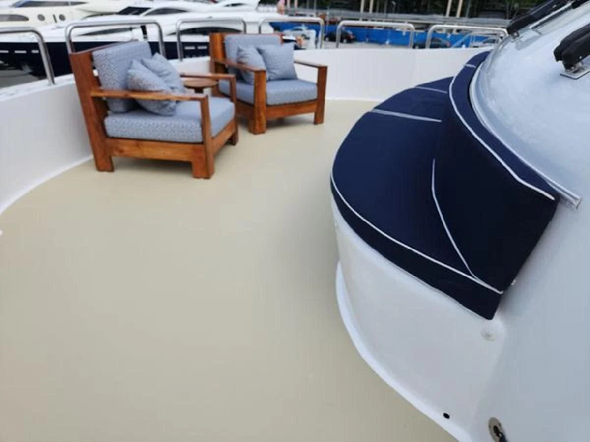 a chair and a table in a room aboard ISLAND HEIRESS Yacht for Charter