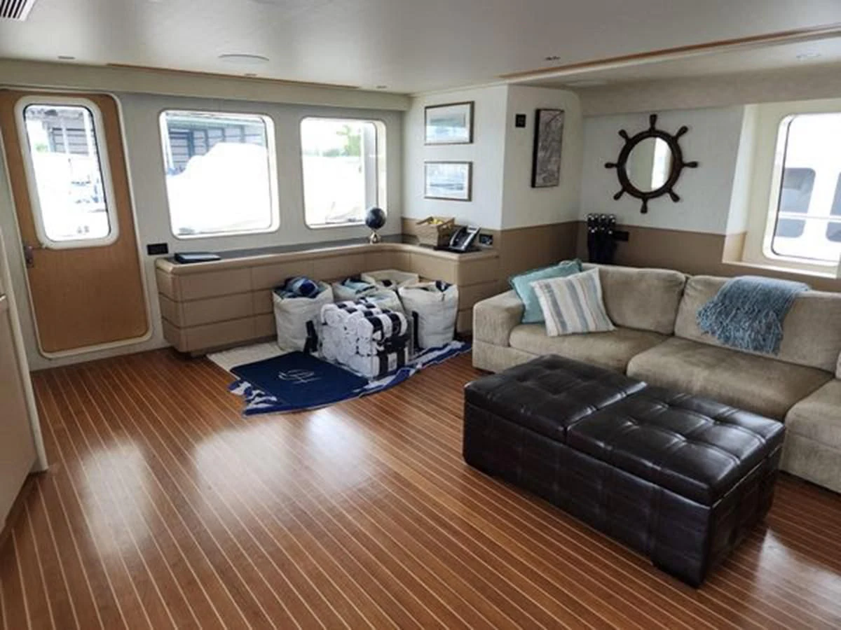 a living room with a couch and a desk aboard ISLAND HEIRESS Yacht for Charter