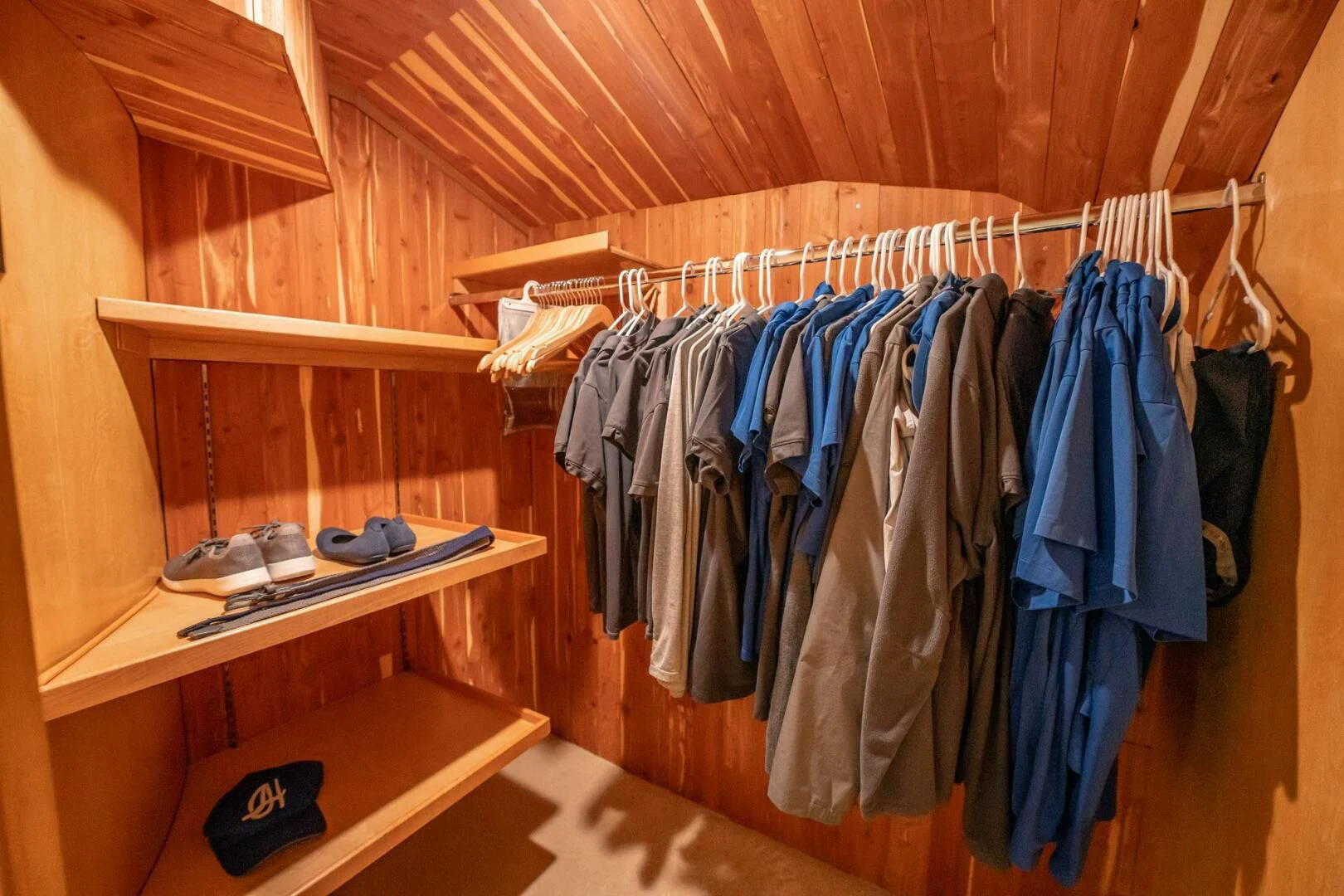 a closet with clothes on the rack aboard ISLAND HEIRESS Yacht for Charter