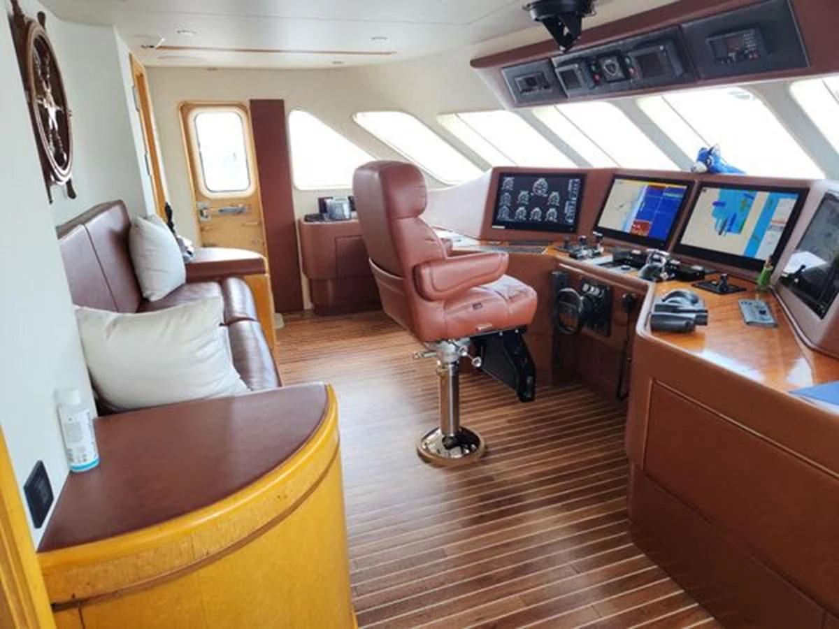 a room with a desk and chairs aboard ISLAND HEIRESS Yacht for Charter