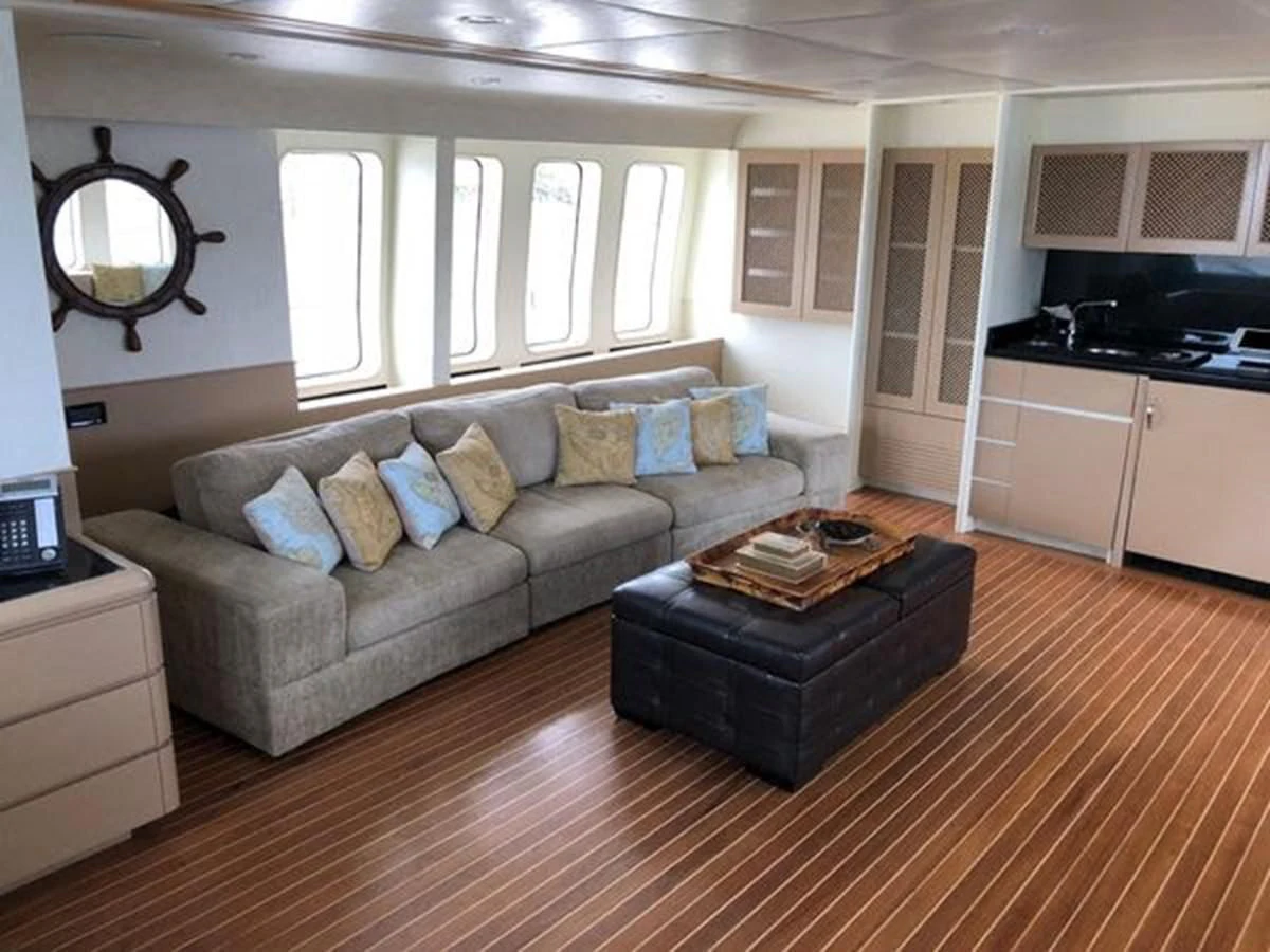 a living room with a couch and a coffee table aboard ISLAND HEIRESS Yacht for Charter