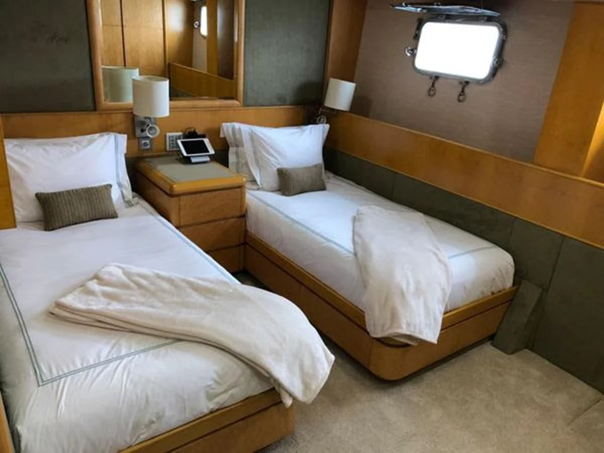 a couple of beds in a hotel room aboard ISLAND HEIRESS Yacht for Charter
