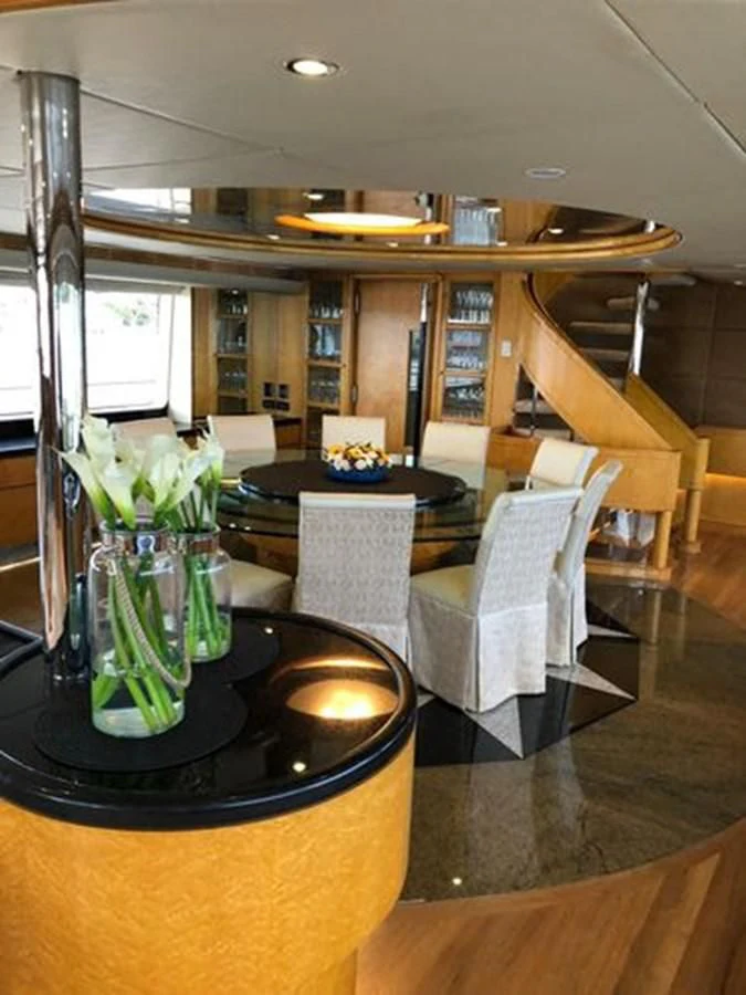 a vase of flowers on a table aboard ISLAND HEIRESS Yacht for Charter