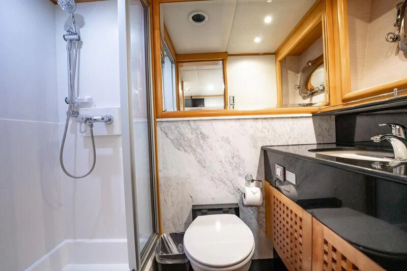 a bathroom with a toilet and sink aboard ISLAND HEIRESS Yacht for Charter