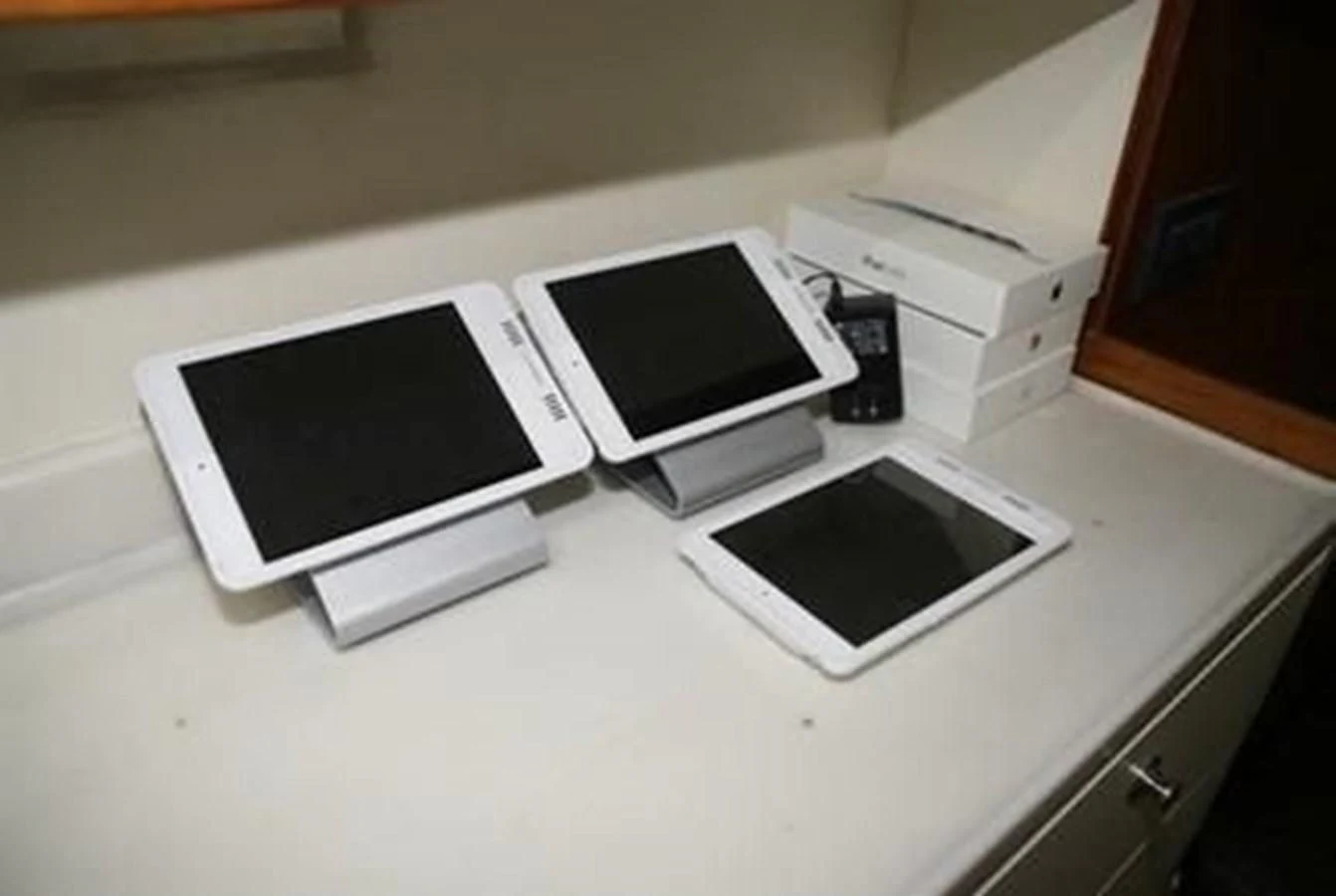 a group of electronic devices on a counter aboard ISLAND HEIRESS Yacht for Charter