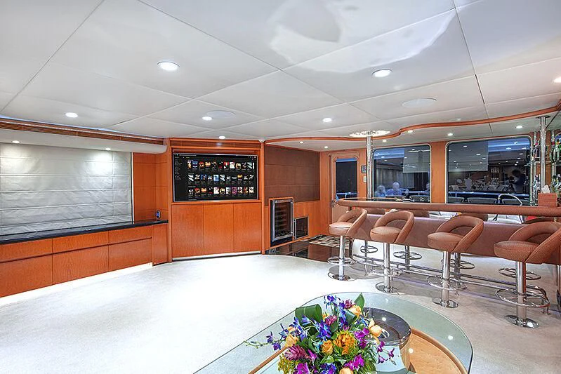 a large room with chairs and tables aboard ISLAND HEIRESS Yacht for Charter