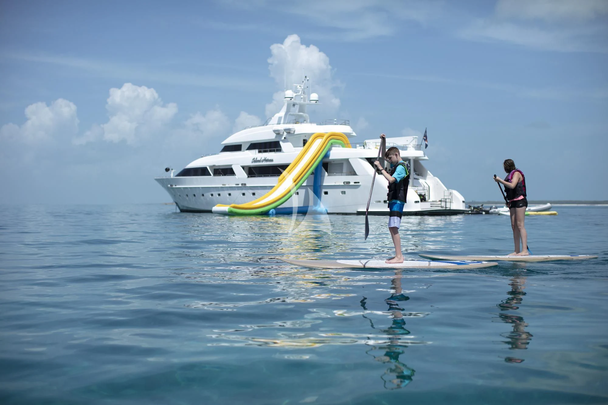 two people standing on a boat aboard ISLAND HEIRESS Yacht for Charter