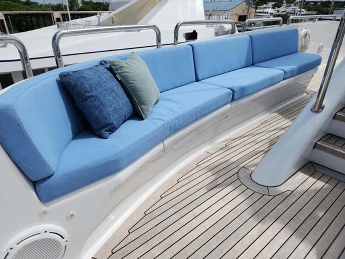 a blue couch on a deck aboard ISLAND HEIRESS Yacht for Charter