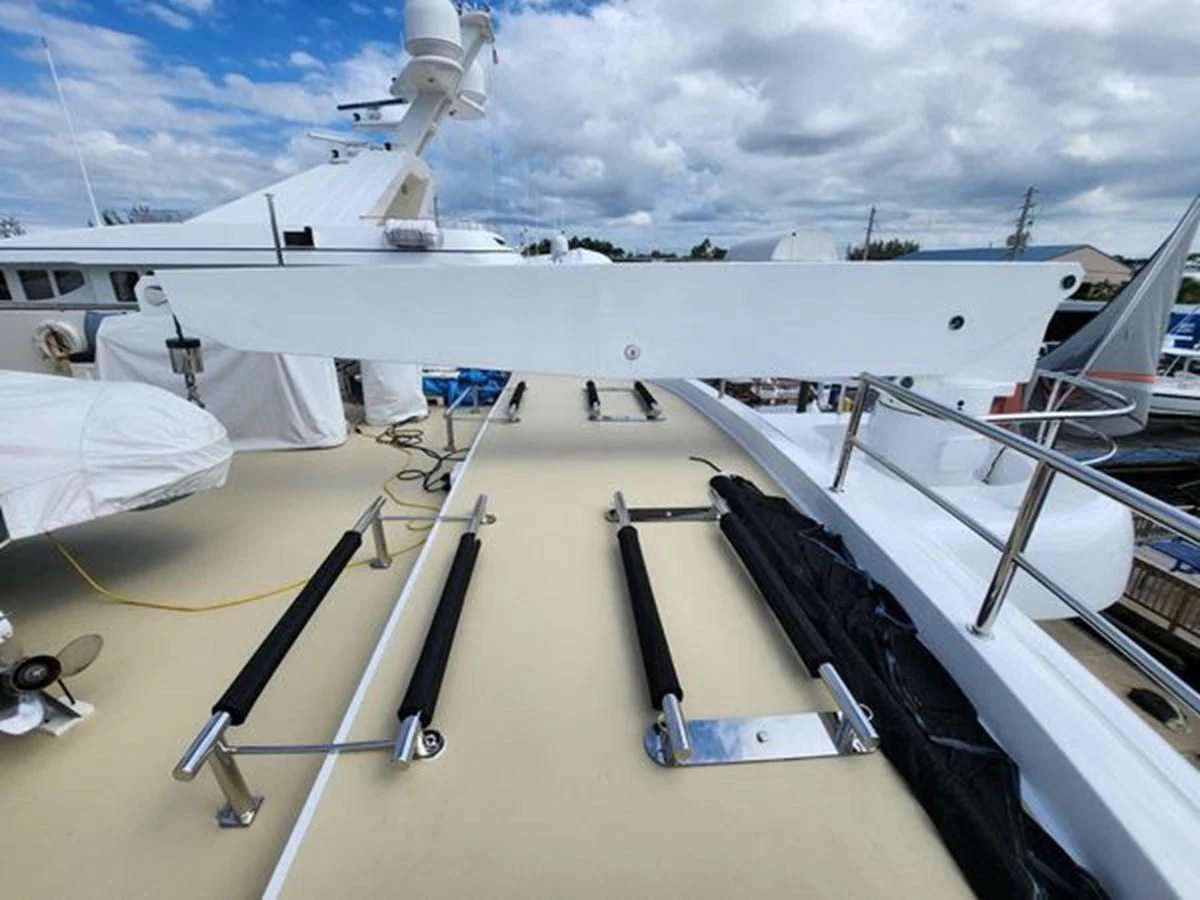 a deck with a boat and a ladder on it aboard ISLAND HEIRESS Yacht for Charter