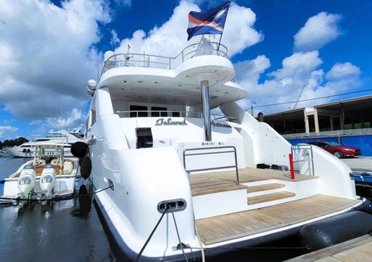 a boat docked at a pier aboard ISLAND HEIRESS Yacht for Charter