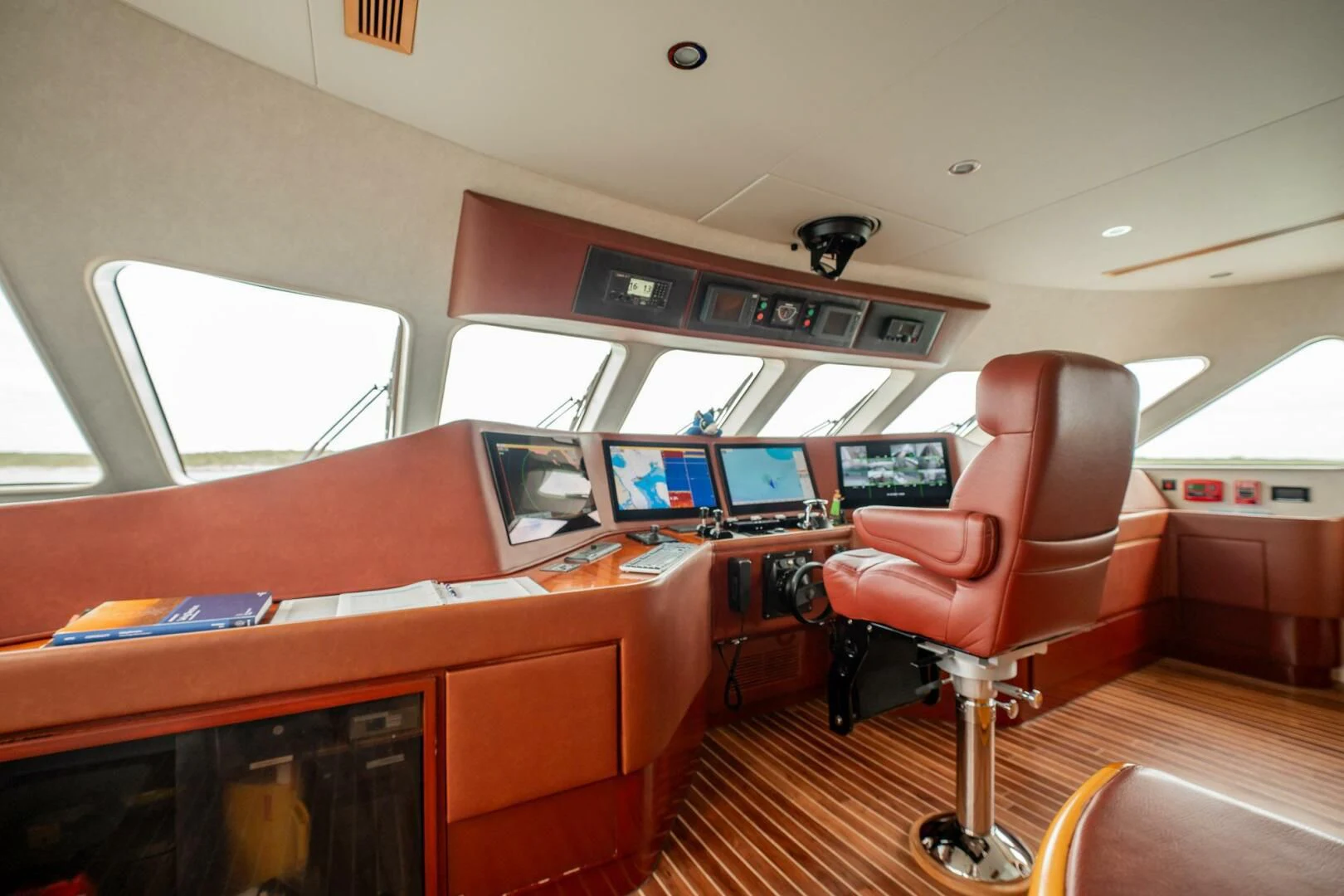 a room with a red chair and a red seat aboard ISLAND HEIRESS Yacht for Charter