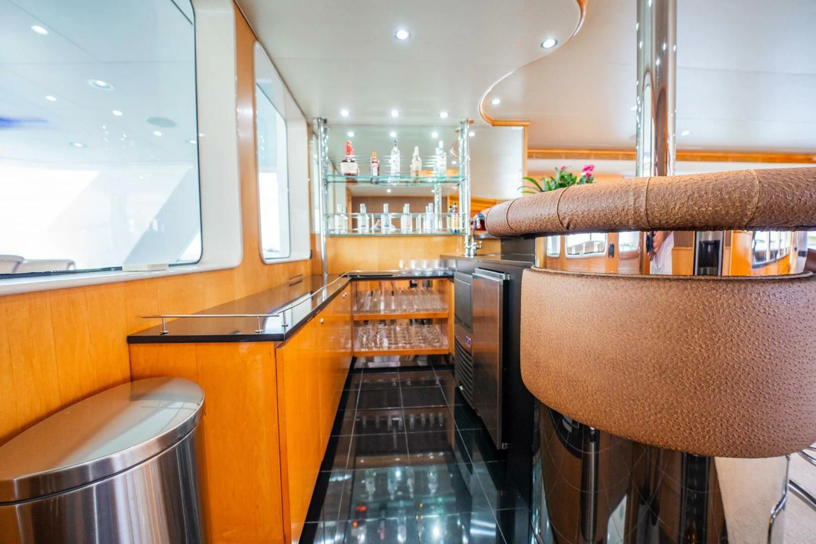 a kitchen with a black counter aboard ISLAND HEIRESS Yacht for Charter