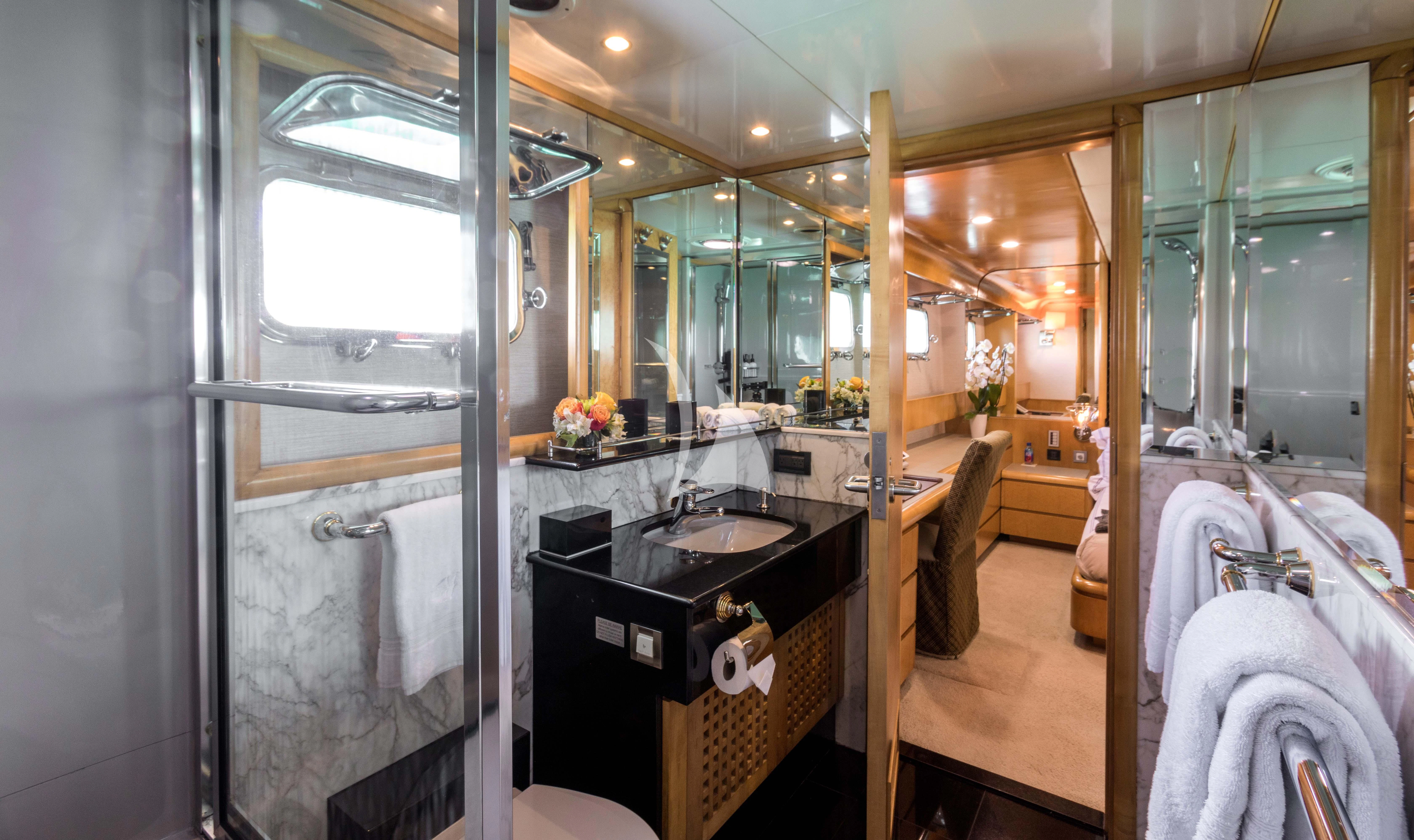 a bathroom with a sink and mirror aboard ISLAND HEIRESS Yacht for Charter