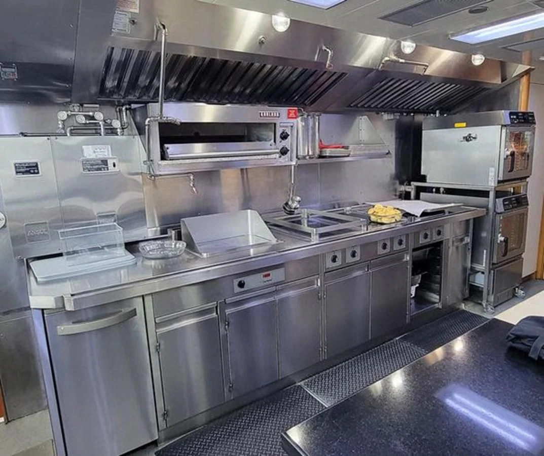a kitchen with stainless steel appliances aboard ISLAND HEIRESS Yacht for Charter