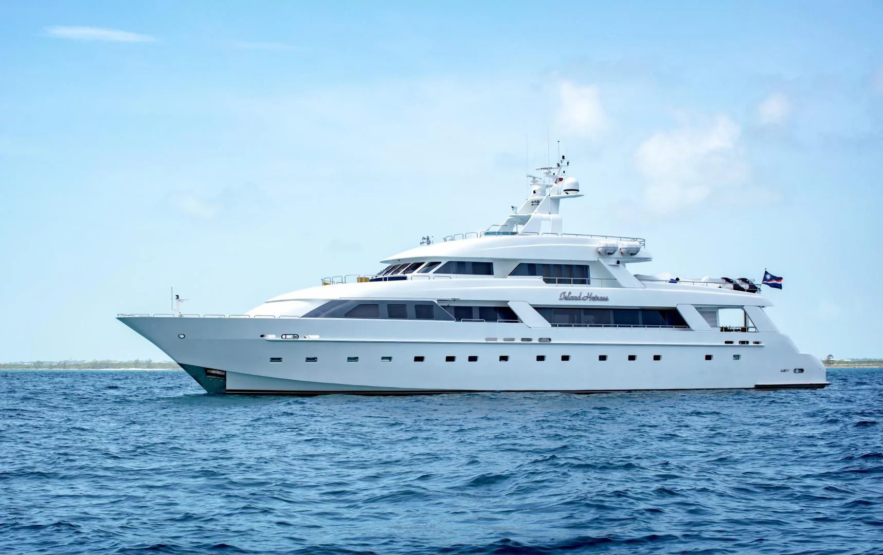 a white yacht in the water aboard ISLAND HEIRESS Yacht for Charter