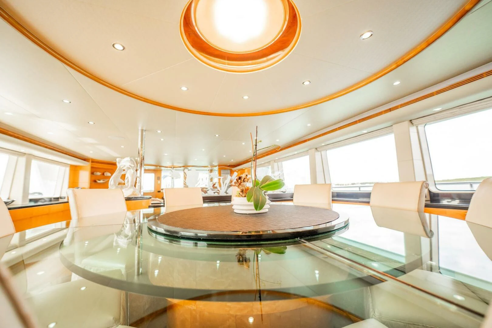 a room with a table and chairs aboard ISLAND HEIRESS Yacht for Charter