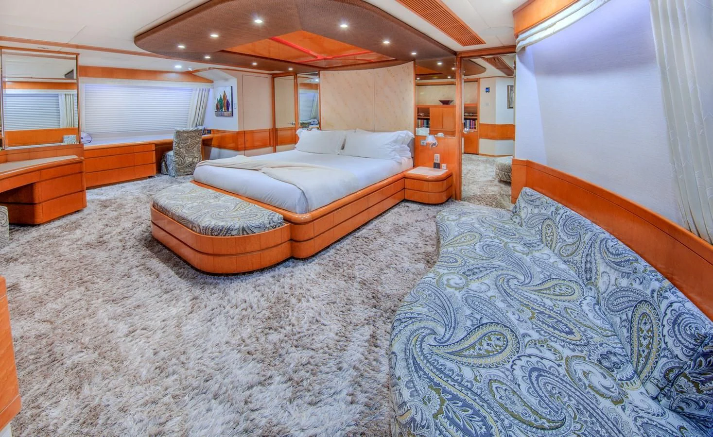 a room with a bed and a desk aboard ISLAND HEIRESS Yacht for Charter