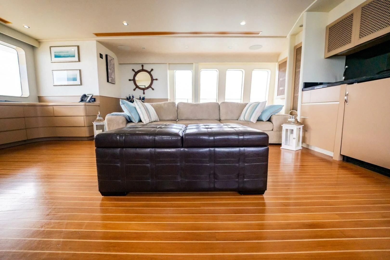 a living room with a wood floor aboard ISLAND HEIRESS Yacht for Charter