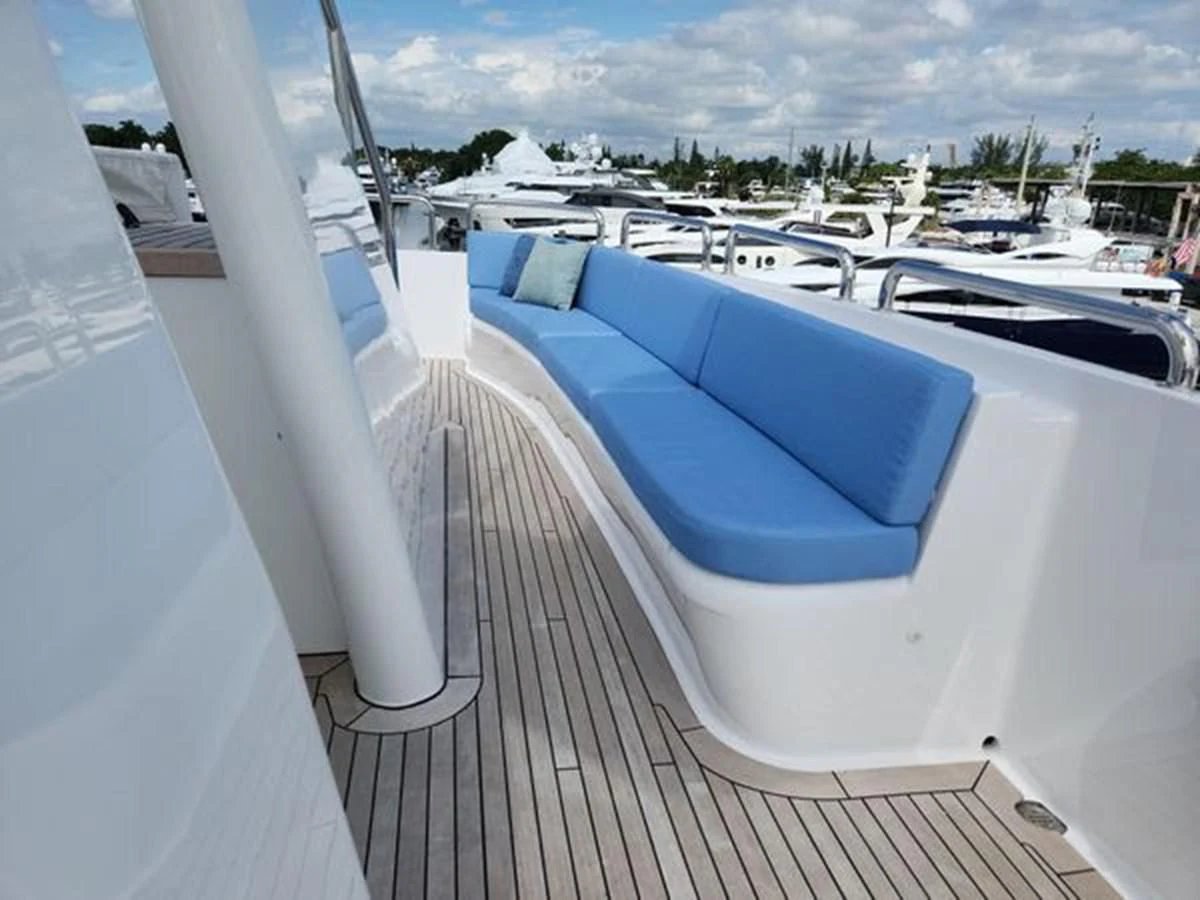 a deck with a pool and boats aboard ISLAND HEIRESS Yacht for Charter