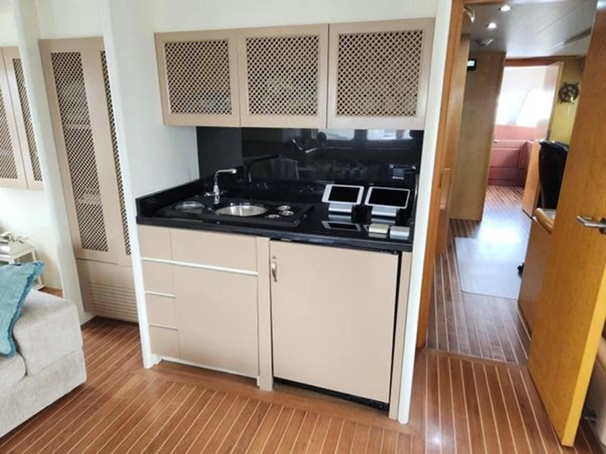 a kitchen with white cabinets aboard ISLAND HEIRESS Yacht for Charter