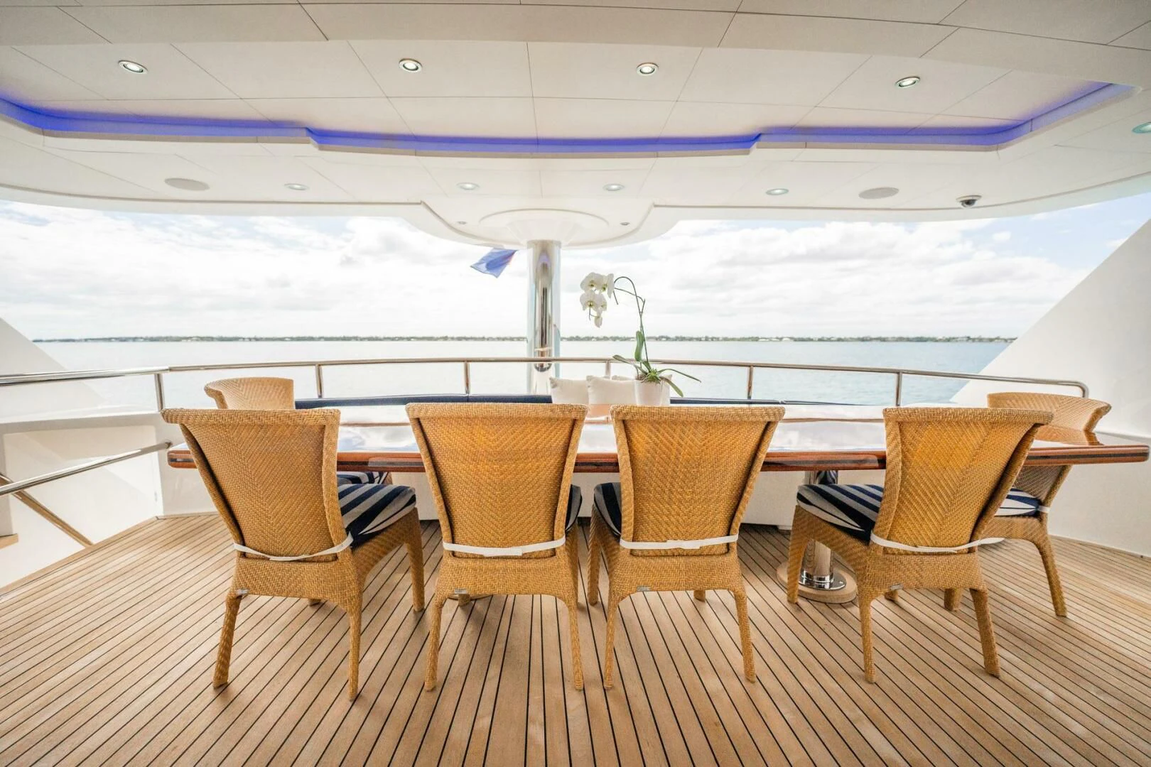 a room with chairs and a table aboard ISLAND HEIRESS Yacht for Charter