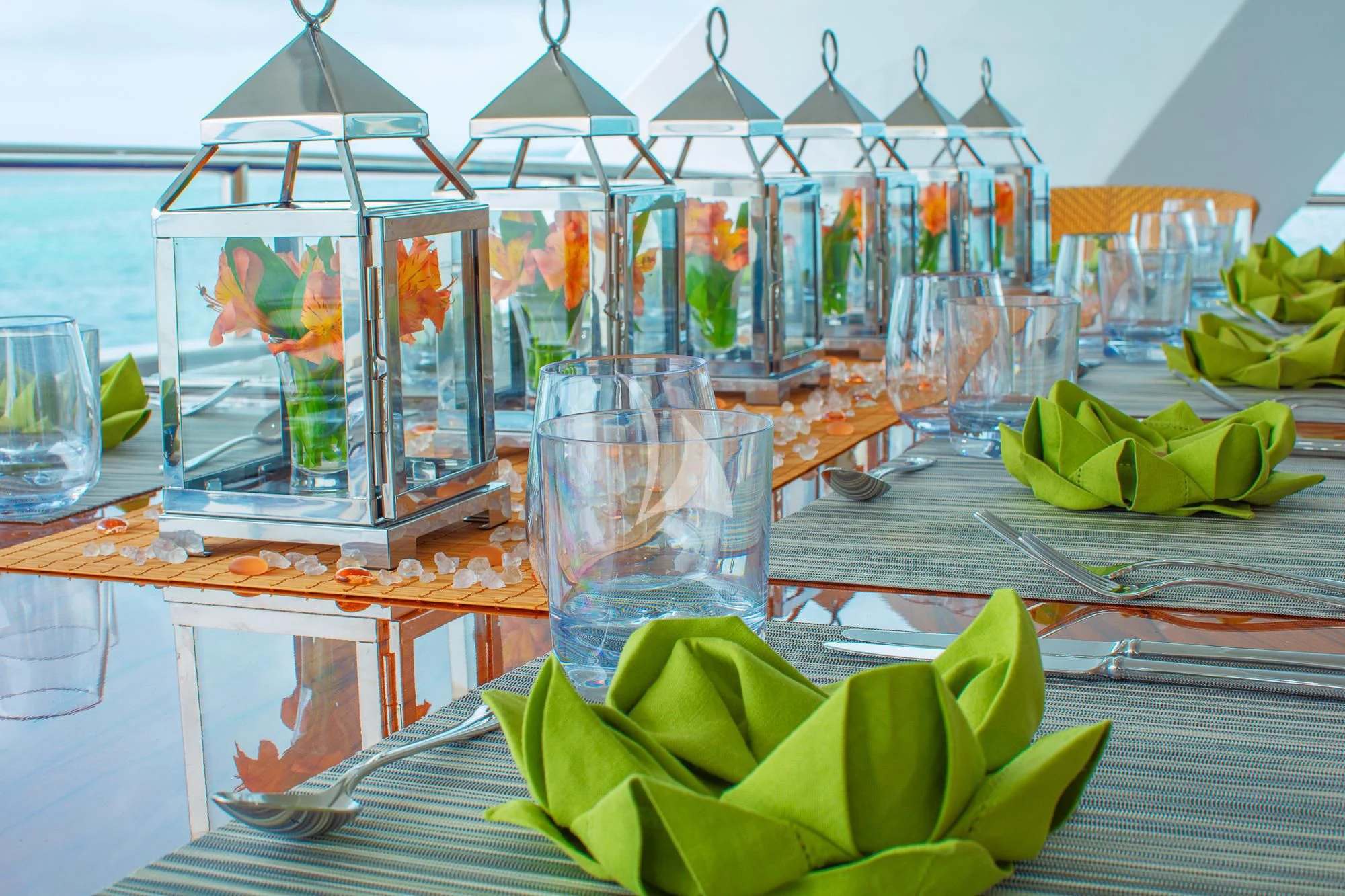 a table with glasses and plants aboard ISLAND HEIRESS Yacht for Charter