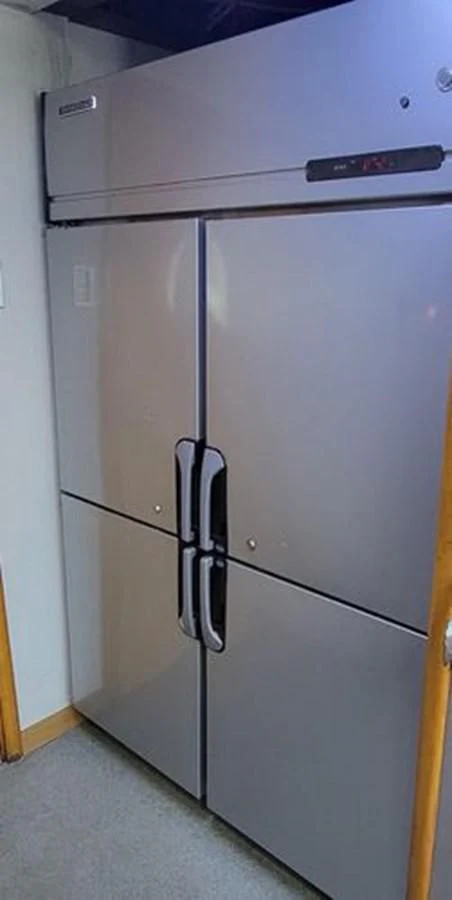 a silver refrigerator in a room aboard ISLAND HEIRESS Yacht for Charter