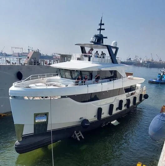 a large white boat with people on it aboard EBYSHINE Yacht for Sale