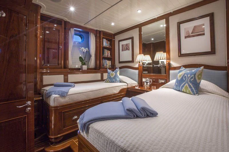 a room with two beds aboard WHISPER Yacht for Sale