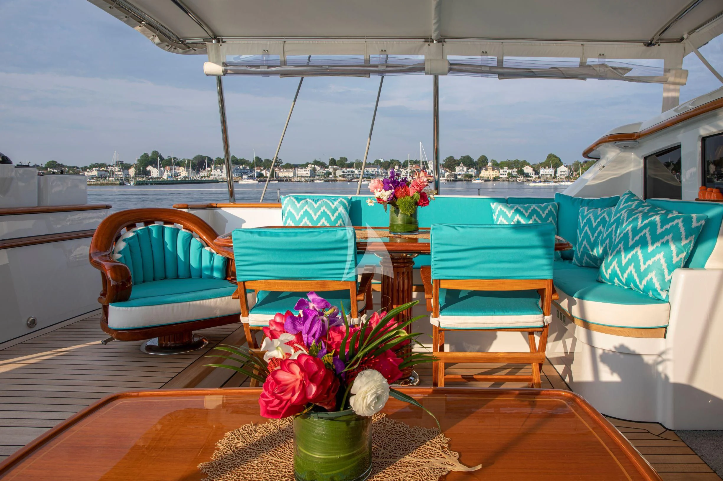 a table with chairs and flowers on it aboard WHISPER Yacht for Sale