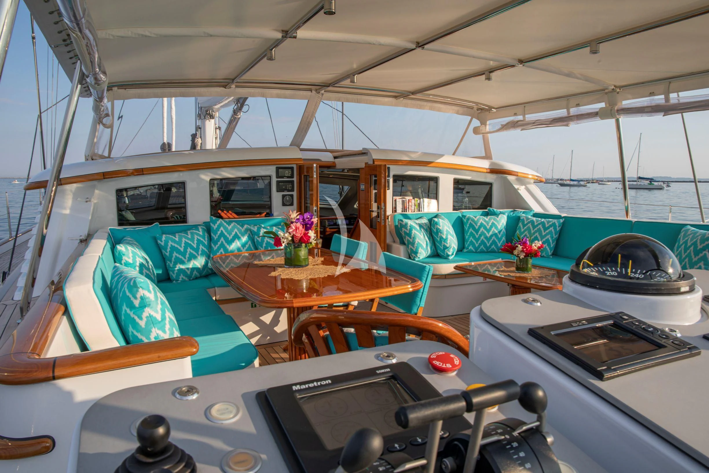 a boat with a table and chairs aboard WHISPER Yacht for Sale