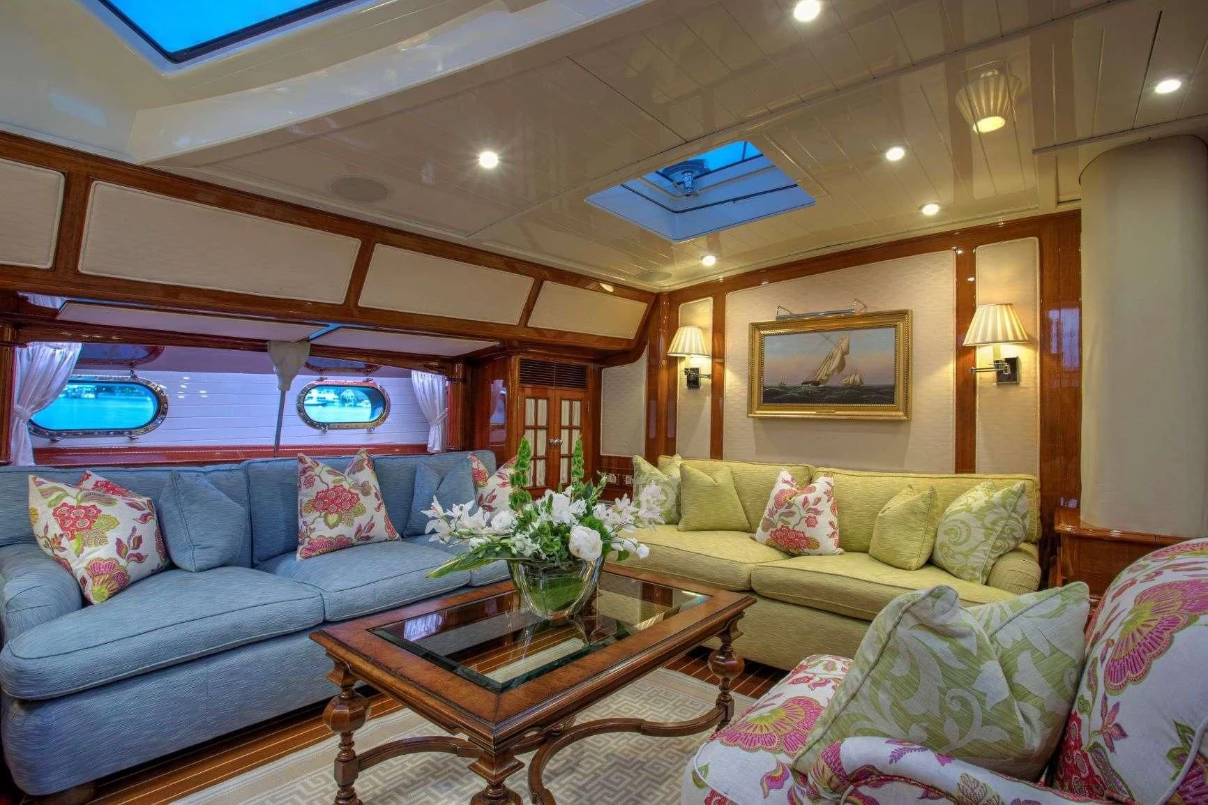 a living room with a couch and a table aboard WHISPER Yacht for Sale