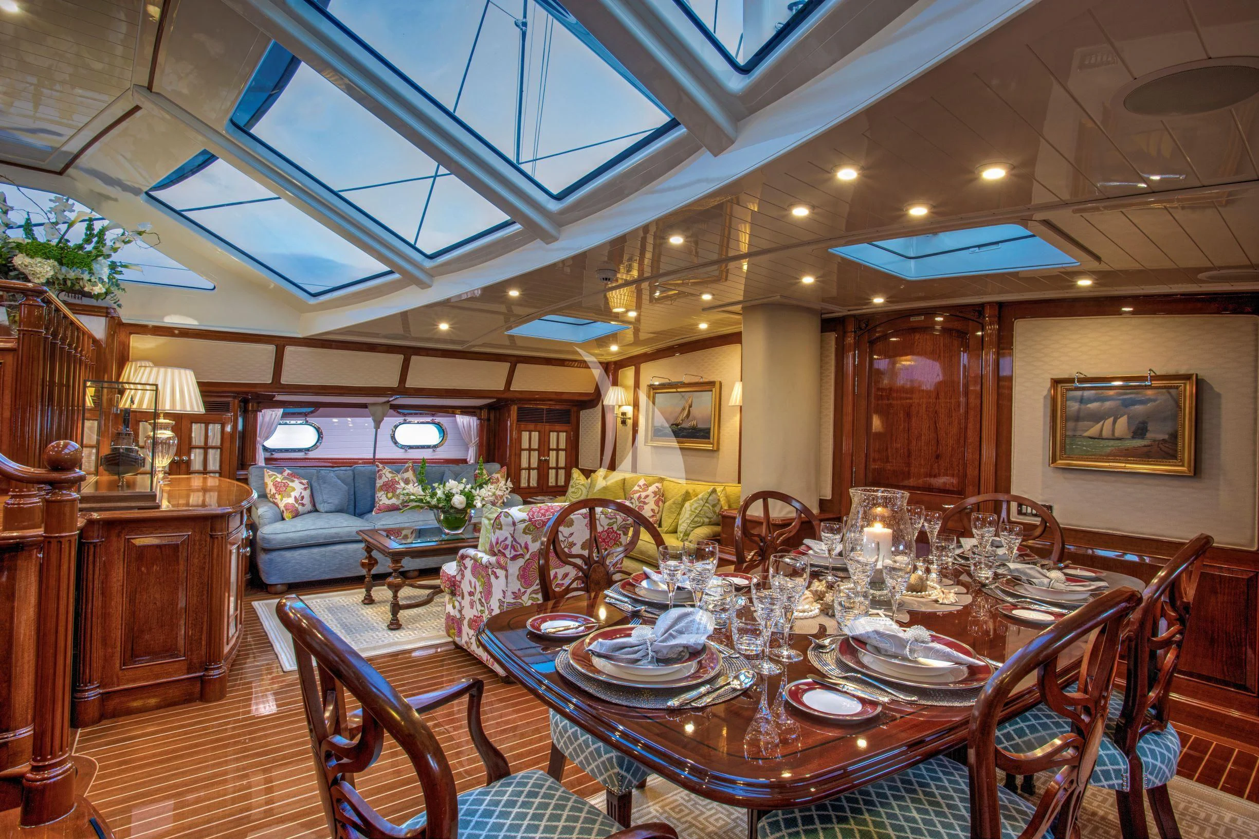 a dining room with a table set aboard WHISPER Yacht for Sale