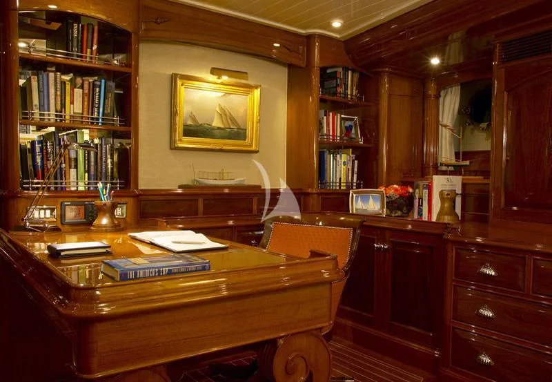 a desk with a computer on it aboard WHISPER Yacht for Sale