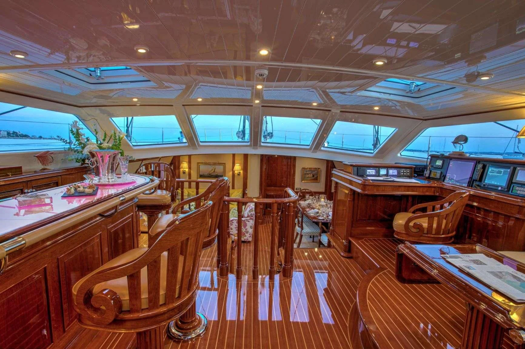 inside of a building with wooden seats aboard WHISPER Yacht for Sale