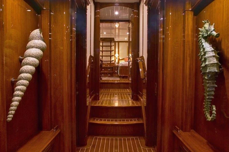a hallway with wood doors aboard WHISPER Yacht for Sale
