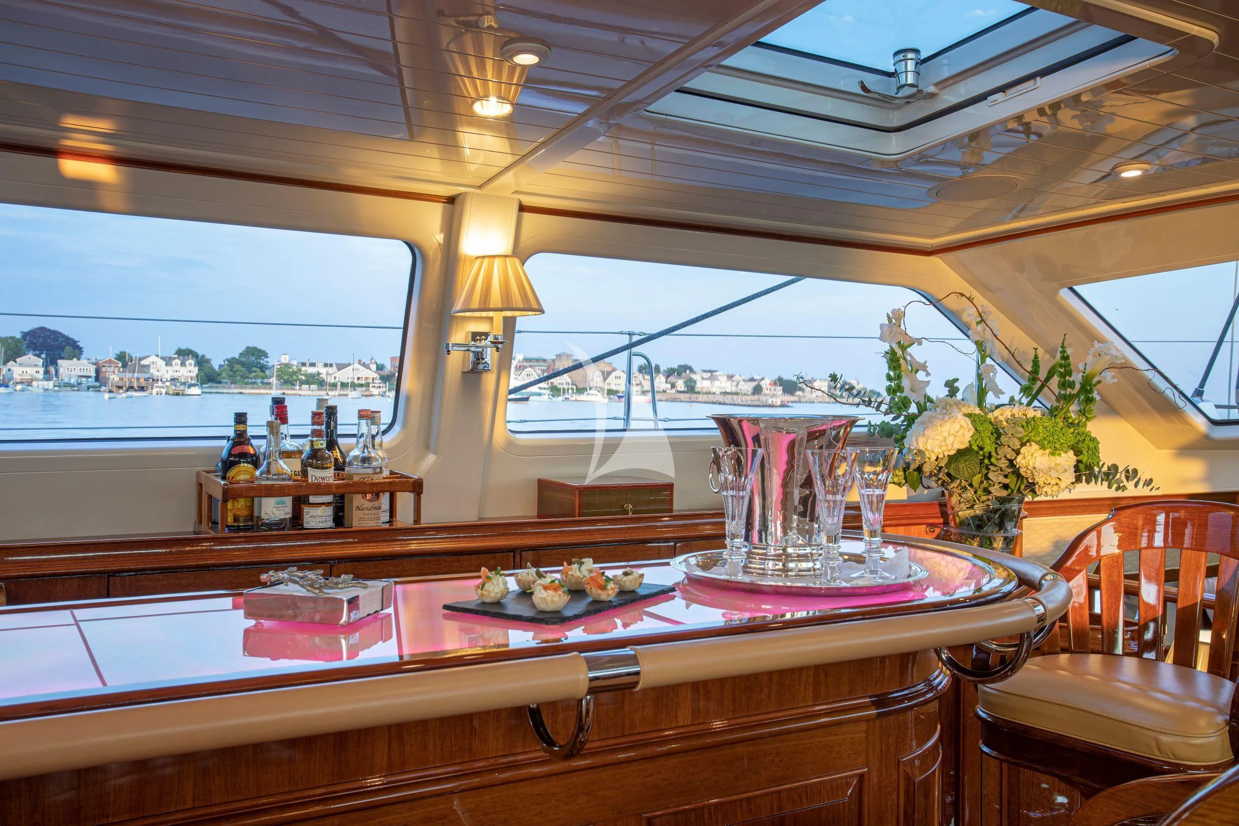 a table with food and drinks aboard WHISPER Yacht for Sale
