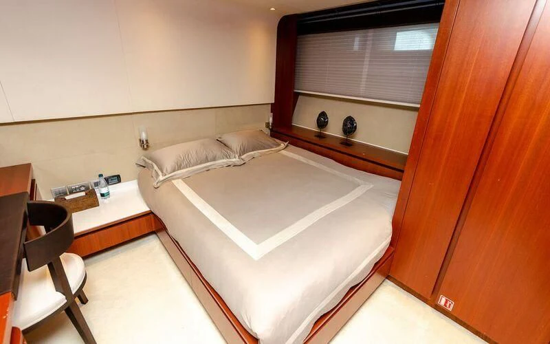 a bed in a room aboard NEW VOGUE Yacht for Sale