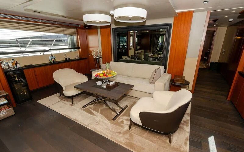 a living room with a large window aboard NEW VOGUE Yacht for Sale