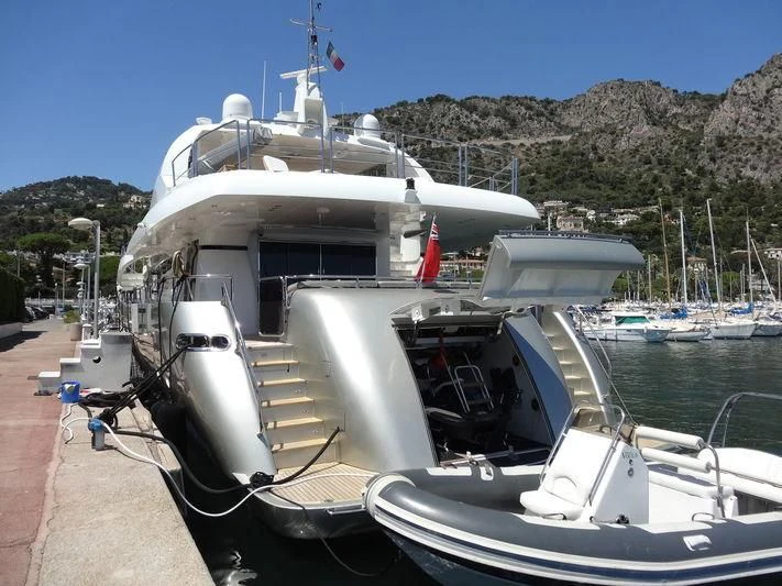 a boat docked at a pier aboard NEW VOGUE Yacht for Sale