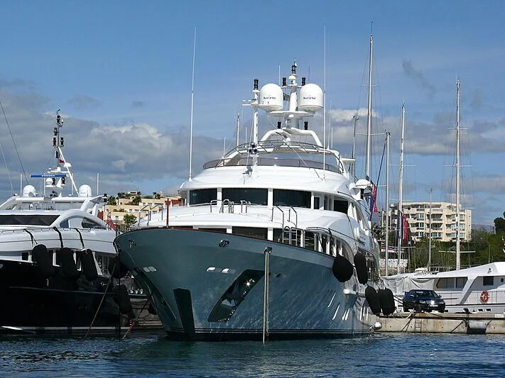 a couple of boats are parked in a harbor aboard SEASCAPE V Yacht for Sale