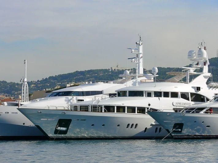 a couple of large white boats in the water aboard SEASCAPE V Yacht for Sale