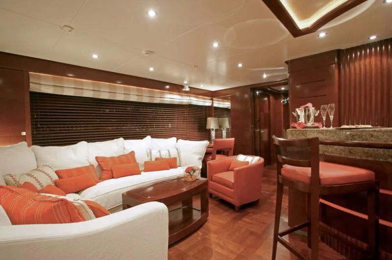 a living room with a couch and a table aboard SEASCAPE V Yacht for Sale