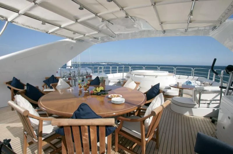 a table set for a meal on a boat aboard SEASCAPE V Yacht for Sale
