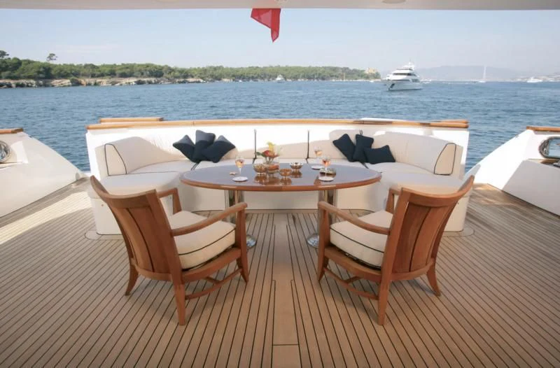 a table and chairs on a boat aboard SEASCAPE V Yacht for Sale
