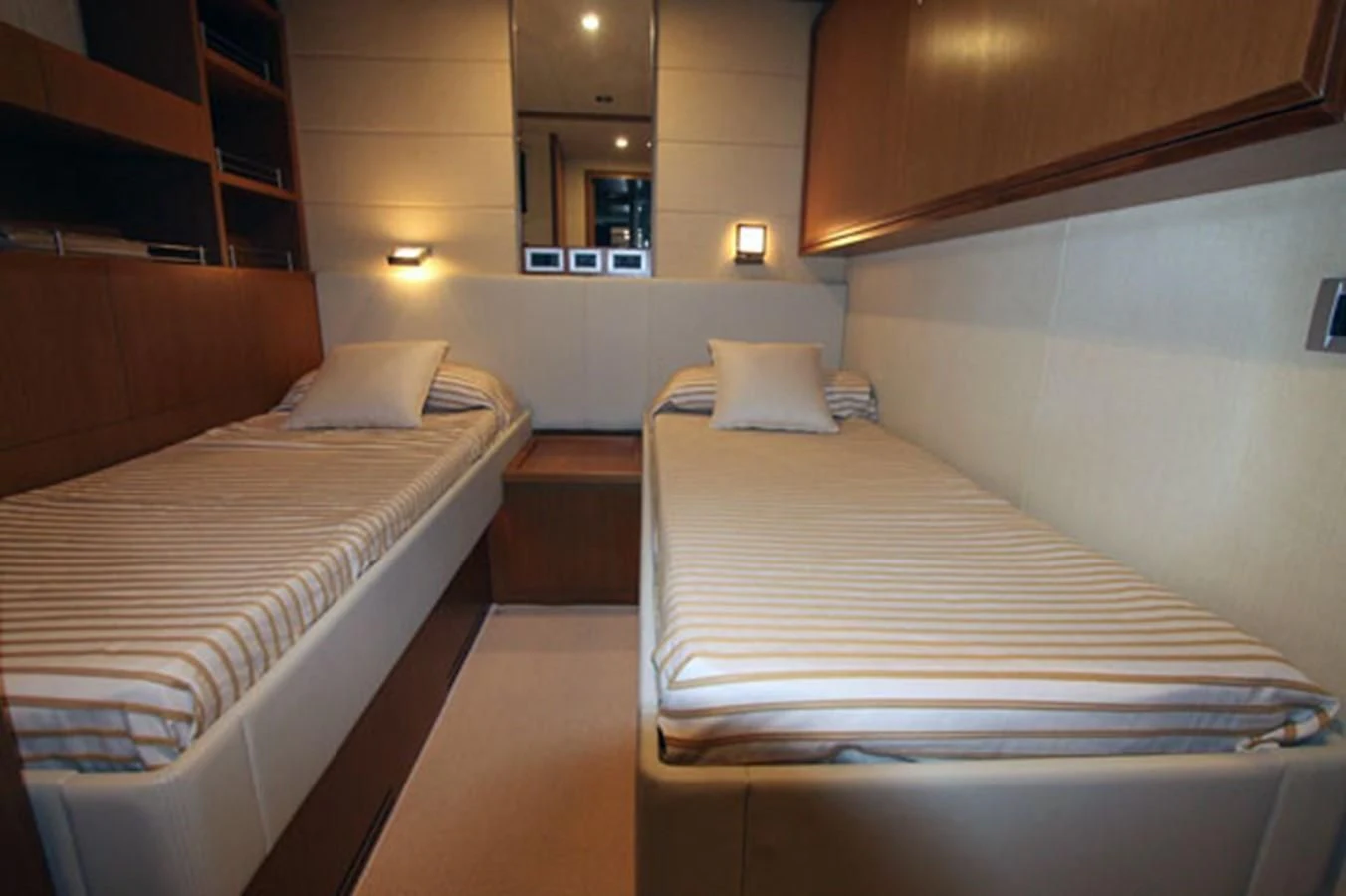a room with beds and a mirror aboard ARGO Yacht for Sale