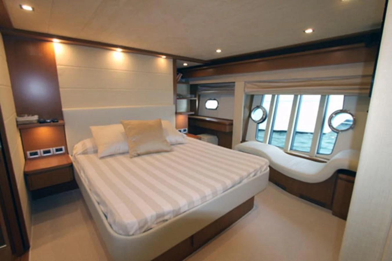a room with a bed and a window aboard ARGO Yacht for Sale
