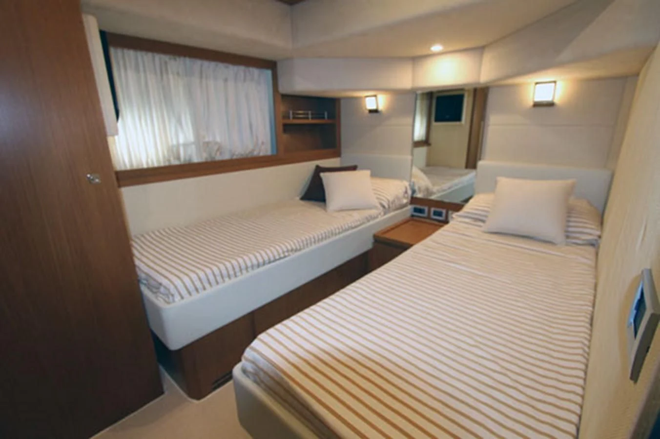 a room with two beds aboard ARGO Yacht for Sale