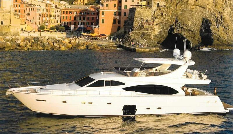 a white boat on a beach aboard ARGO Yacht for Sale