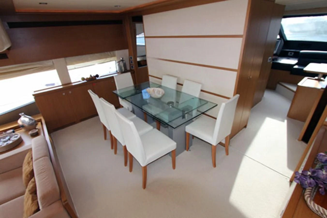a room with a table and chairs aboard ARGO Yacht for Sale